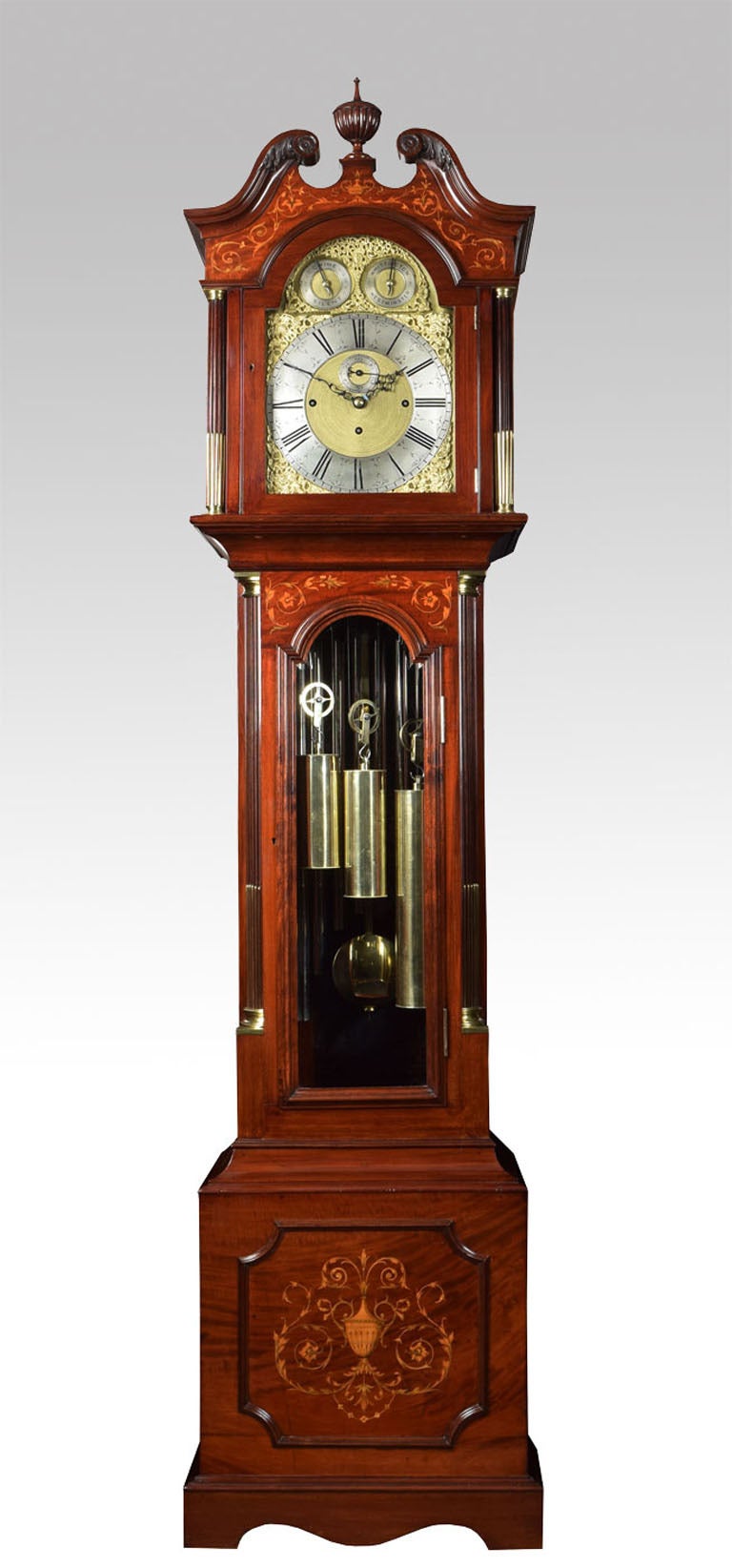 Edwardian mahogany inlaid tubular chiming longcase clock the case having a swan neck pediment with central turned finial over arched bevelled glazed hood door flanked by fluted pillars finely inlaid with tendrils and flowers, and leaf decoration the