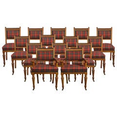 Set of fourteen oak dining chairs