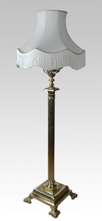 Victorian brass standard lamp, with Corinthian column and adjustable top column, on stepped square base with bracket feet  (has been re-wired)