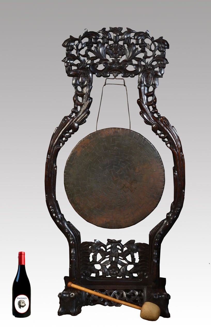 Chinese intricately carved and pierced hardwood dinner gong, having circular brass gong to centre inscribed Burmese with original beater.
Dimensions

Height 50 Inches

Width 25 Inches

Depth 14 Inches

Gong Diameter 18.5 Inches