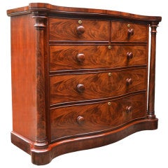 Antique flame mahogany serpentine fronted chest of draws