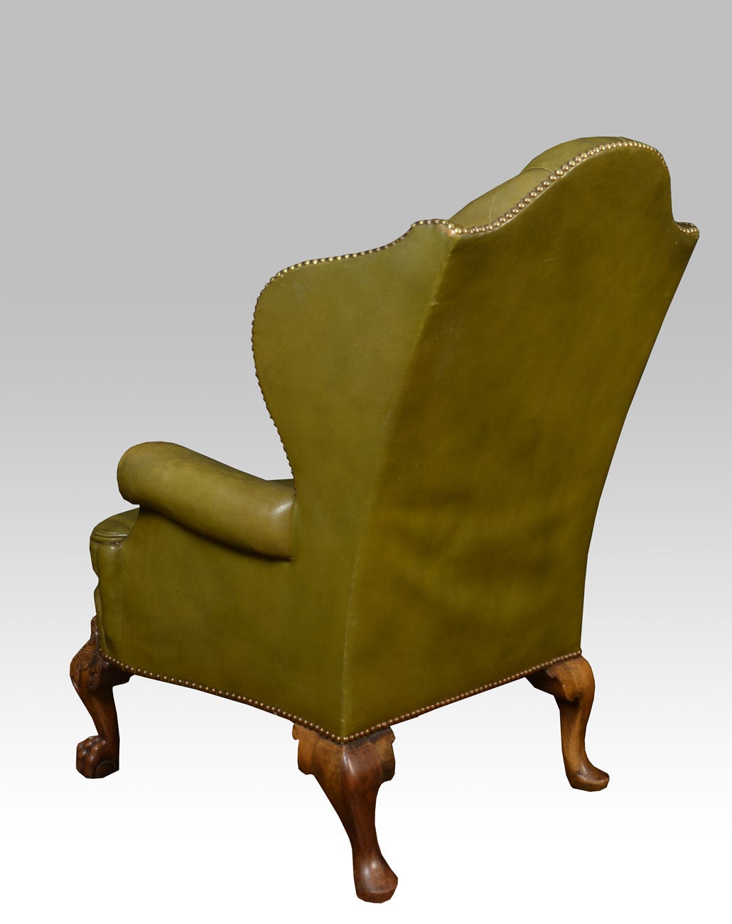 Leather Pair of leather wing armchairs in the George II style