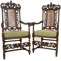 Pair of carved oak arm chairs