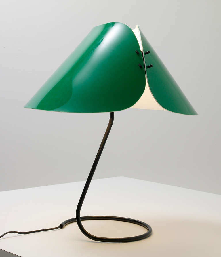 PRODUCER: O-Luce
No longer produced since 1985

Base and stem in black lacquered metal, two-part green Perspex swiveling lampshade.

Bibliography:
— Catalogue O-Luce, p.64
— Vico Magistretti, Elegance and innovation in Postwar Italian Design,