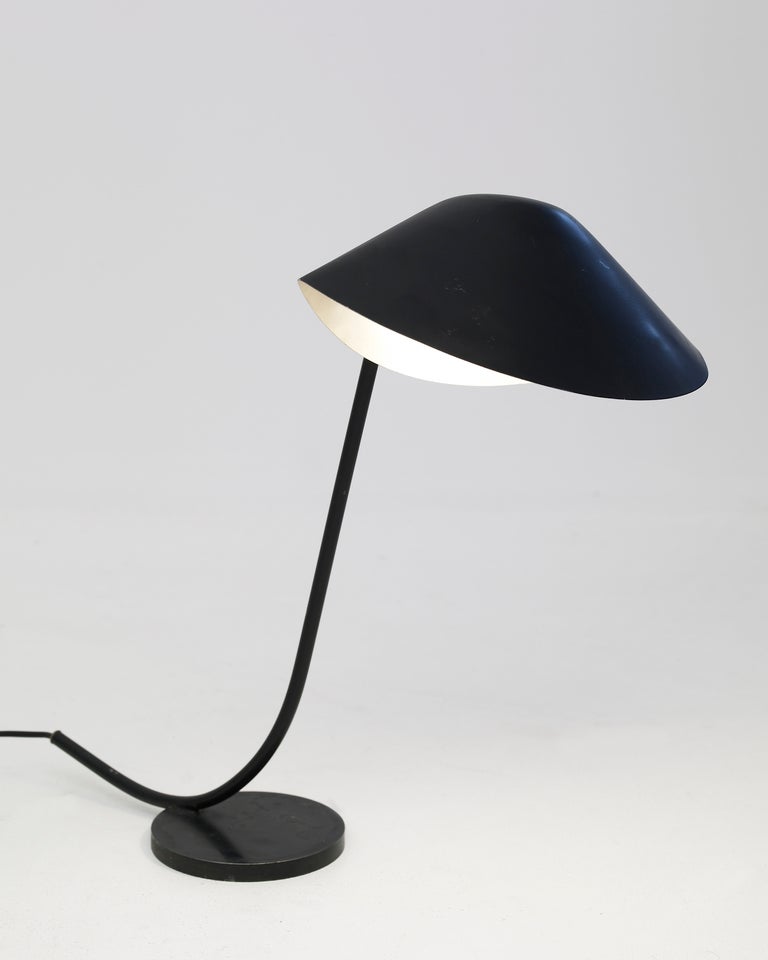 PRODUCER: Atelier Serge MOUILLE
No longer produced

Base and stem in steel, directing lampshade in black mat lacquered metal outside and white mat lacquered inside.

Bibliography :
— Serge Mouille, a french classic, P. E. Pralus, Ed. du Mont