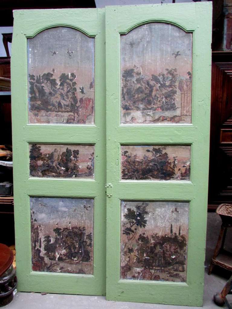 18th century
 pair of louis XIV pine doors
decorated with painted gravures of the same period
a missing piece on the left top of one door ( first picture )
the gravures have some defects but which give a lot of charm
original patina