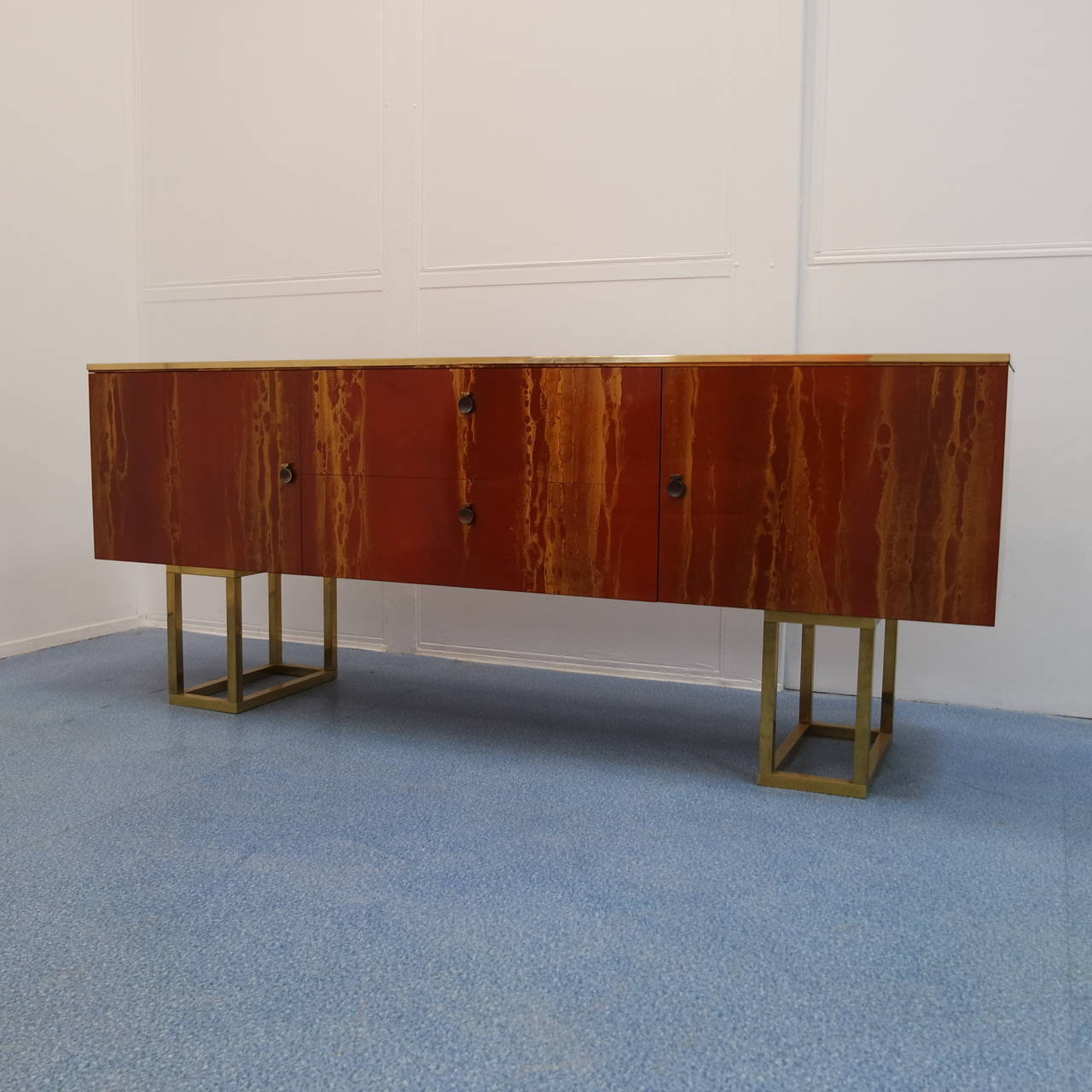 Large enfilade by Guy Lefèvre for Jansen, red and gold formica, mahogany wood, brass feet and details