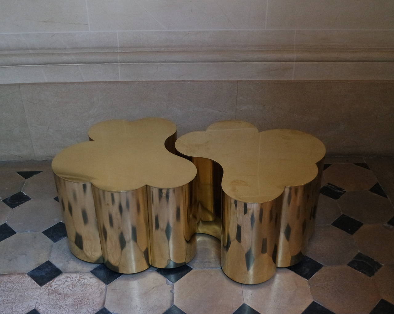 Two tables in brass designed by Edouard De La Marque made in brass, they can fit together forming a large coffee tables or on each side as end tables.