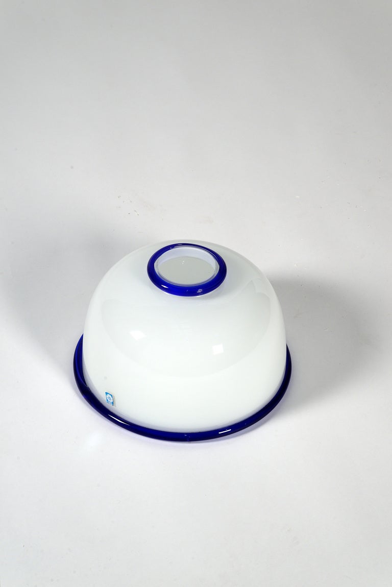White opaline glass vase with blue profiles designed by Ettore Sottsass, manufactured by Vistosi in 1974. Original sticker.