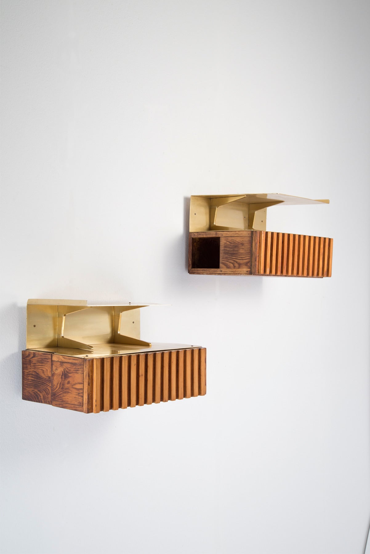 Pair of wall mounted night stands designed by architect Nestorio Sacchi in 1949. Unique pieces made for a private commission. Anodized aluminum top, wooden structure with an opening facing the bed side and one single drawer.