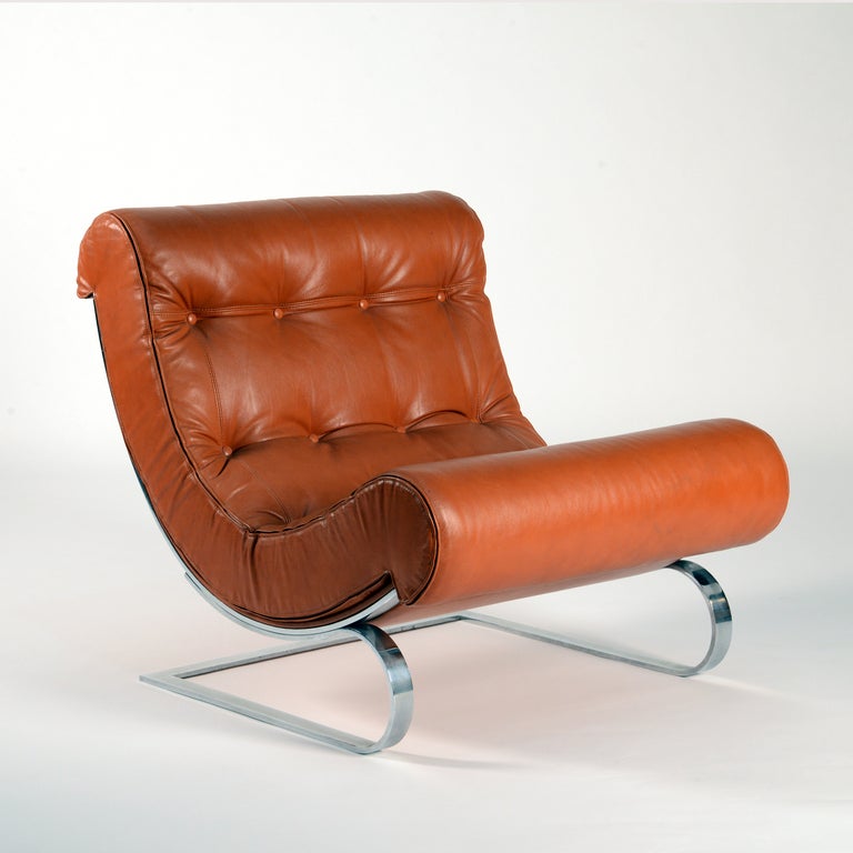 Leather lounge chair manufactured in early 70s by Cinova. As this chair comes from an old stock is in perfect original condition. Particular elastics shape of the steel structure allows the chair to rocks when seated.