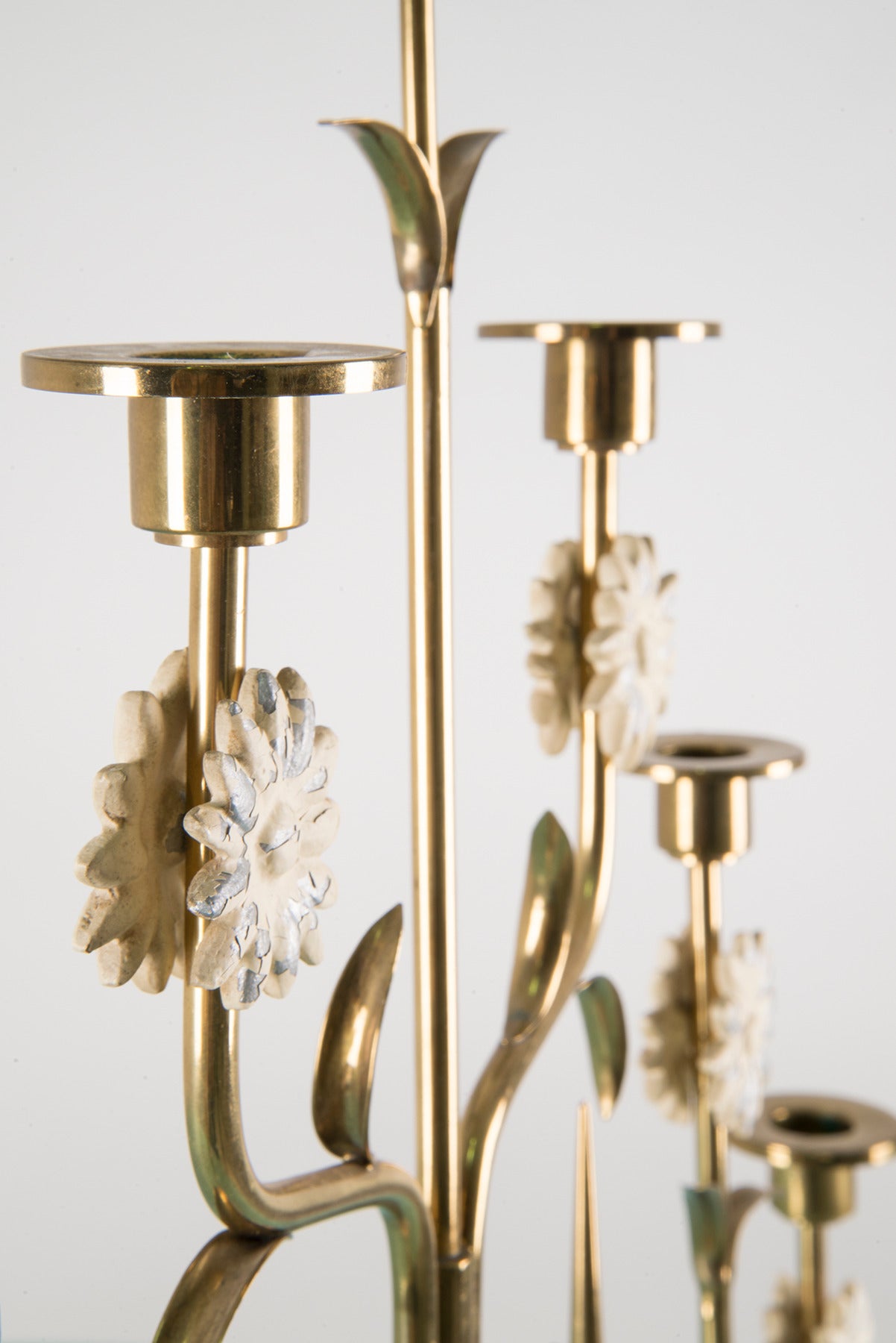 Extraordinary six arm candelabra manufactured by Stilnovo in the 1950s. White Carrara marble base, brass structure, white lacquered metal decorations. Manufacturer's mark located on the brass.