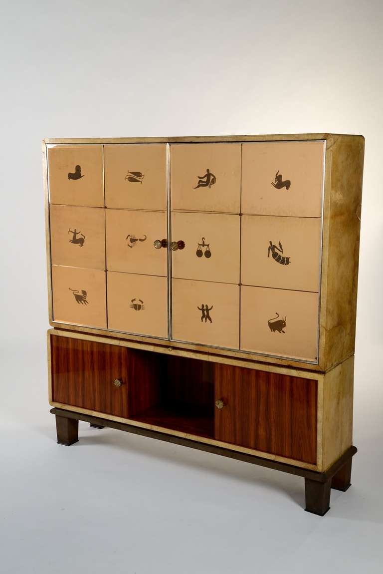 Extraordinary cabinet designed by Gio Ponti and manufactured by Paolo Lietti & Figli, Cantù in 1930. Doors made of twelve mirrors representing the zodiac and signed by Luigi Fontana. Sides are covered with white parchment, the base is made of