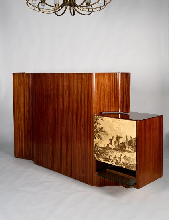 Amazing sideboard / room divider designed in 1935 by the architect Giorgio Ramponi for a private commission in Bologna. The sideboard has a containing side with an open display cabinet and a bar side with a decorated door and internal lightning. The