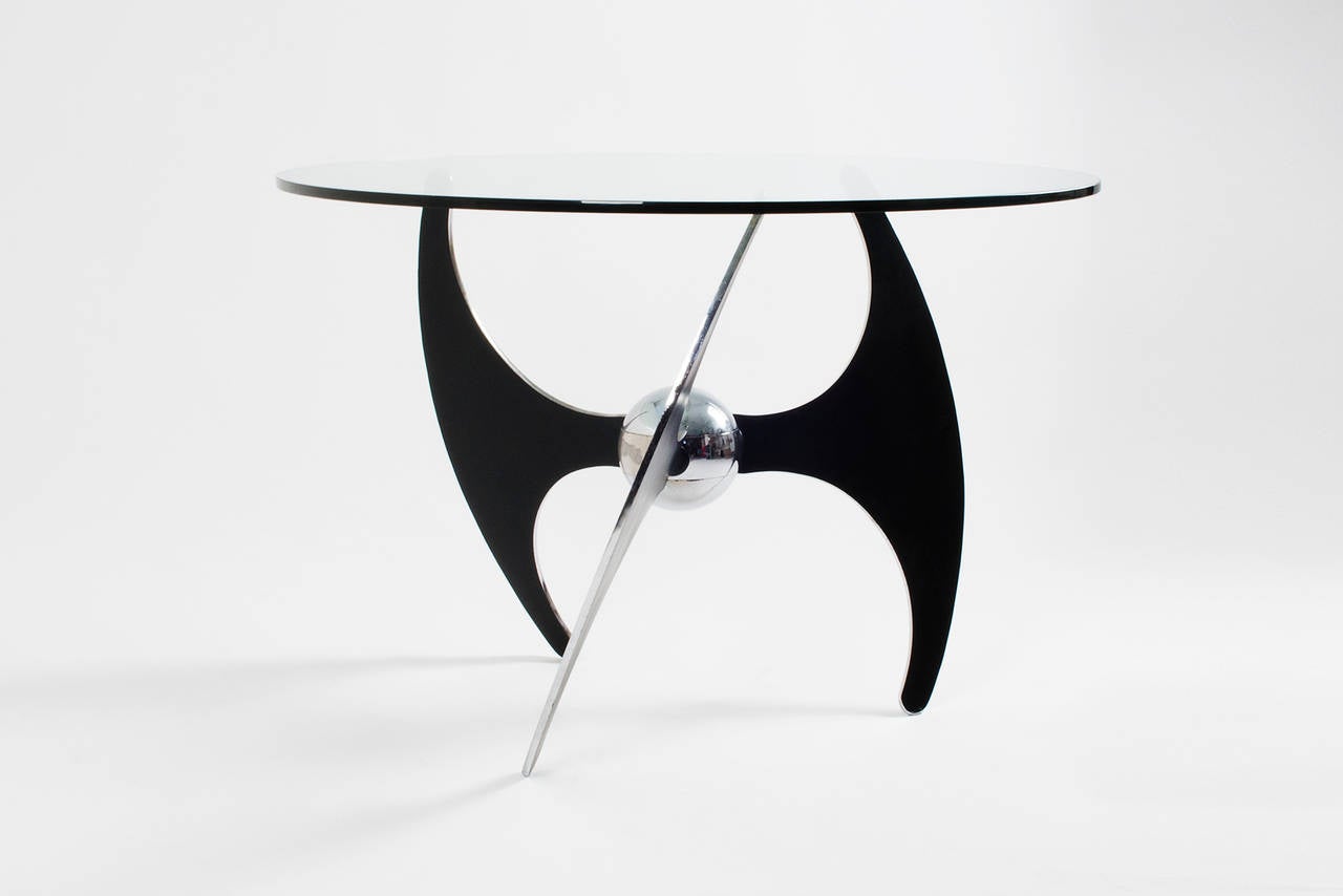 Unusual coffee / dining table designed by L. Campanini for Cama in 1973. Bicolor (black / chrome) brushed steel structure with crystal top. The height of the table can be adjusted by simply rotating the steel legs and fixing them through the locks