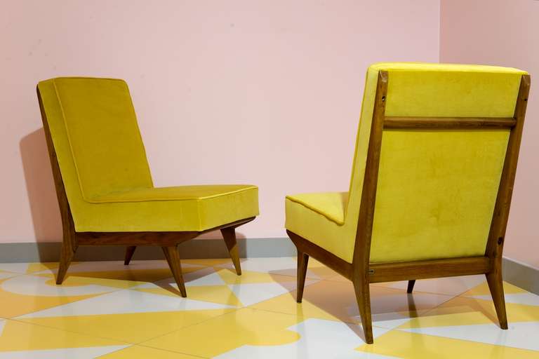 Pair of armchairs designed and manufactured by Silvio Cavatorta in 1950. Wooden structure, high quality velvet upholstering. Completely restored. Marked on the back.