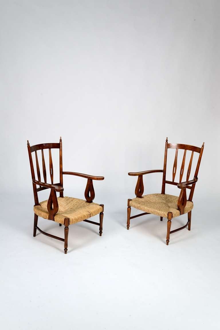 Pair of oak wood and straw seat paolo Buffa armchairs from the 1930s. This chairs have been recently restored and so they are in mint condition.