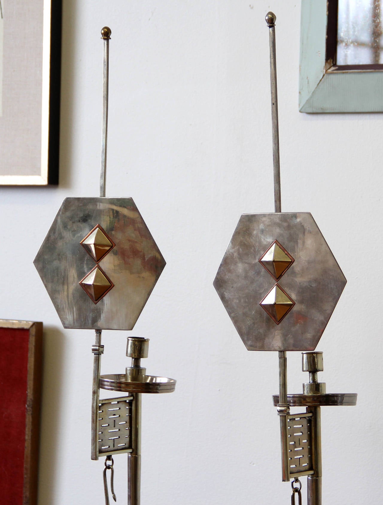 This is a rare pair of adjustable antique Japanese nickel-silver candle holders with hanging wick trimmers circa 1900-1910. The pair were gifted to Dr. William S. Fulton (1873-1938) while on a grand tour of Asian countries. Dr. Fulton was the
