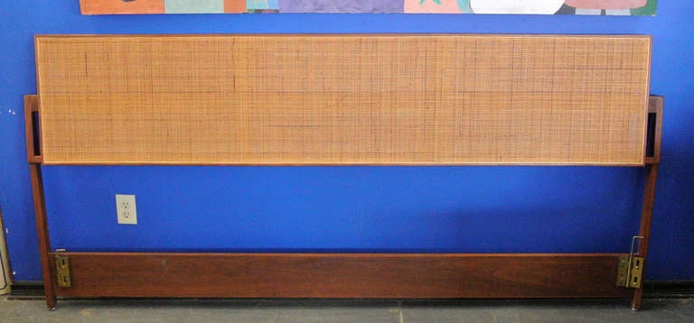 Rare Jens Risom mid-century walnut caned headboard.  Currently set for a king size mattress the metal hardware can be adjusted inwards to fit a queen. Please email if you need more specific dimensions.