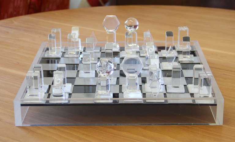 1970's modernist lucite chess set with game board and cover.