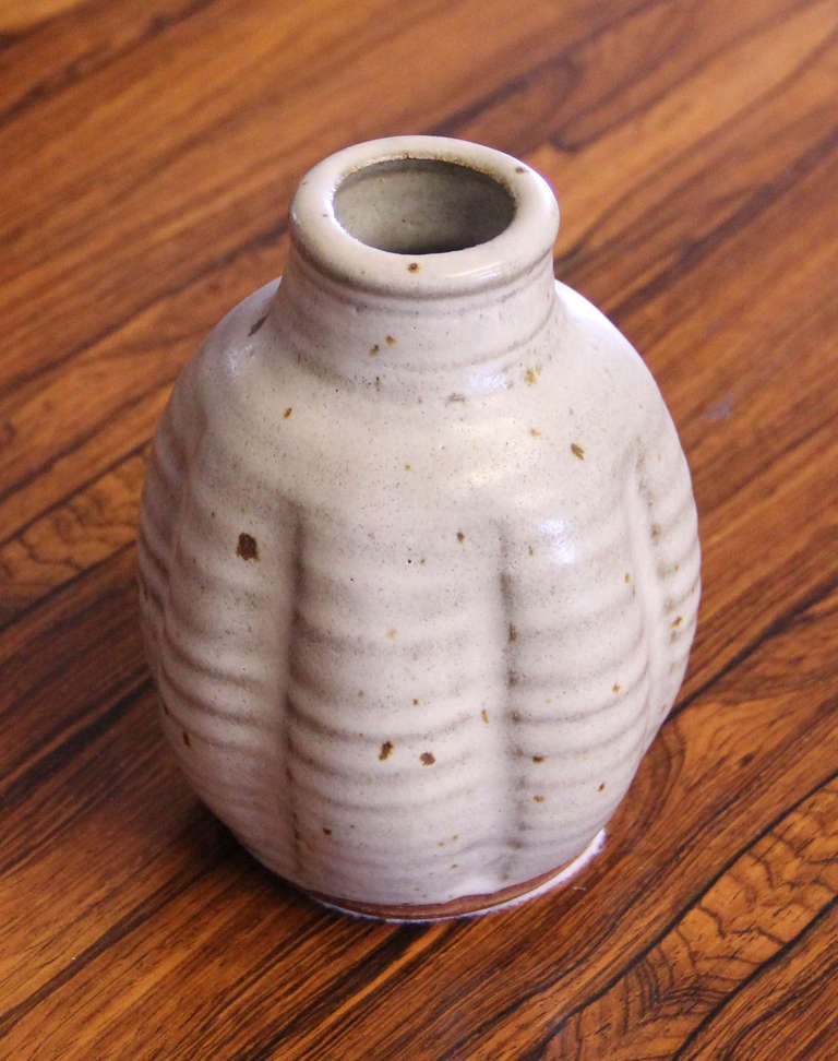 This Warren MacKenzie studio pottery vase was purchased by the original owner from Warrens studio in the 1970's. In excellent condition with signature glaze and thumbprint base.