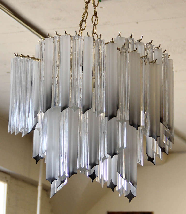 Stylish lucite prism cascading waterfall two-tier spiral chandelier by Triarch International industries. Eighty 10