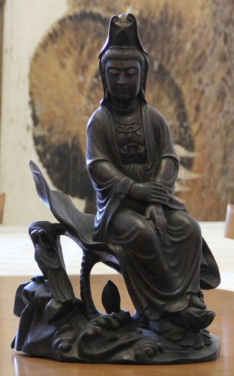 A nicely carved wood statue Bodhisattva Guanyin. Venerated in both the Buddhist and Taoist religion. This particular version dates to the 1st half of the 20th Century.