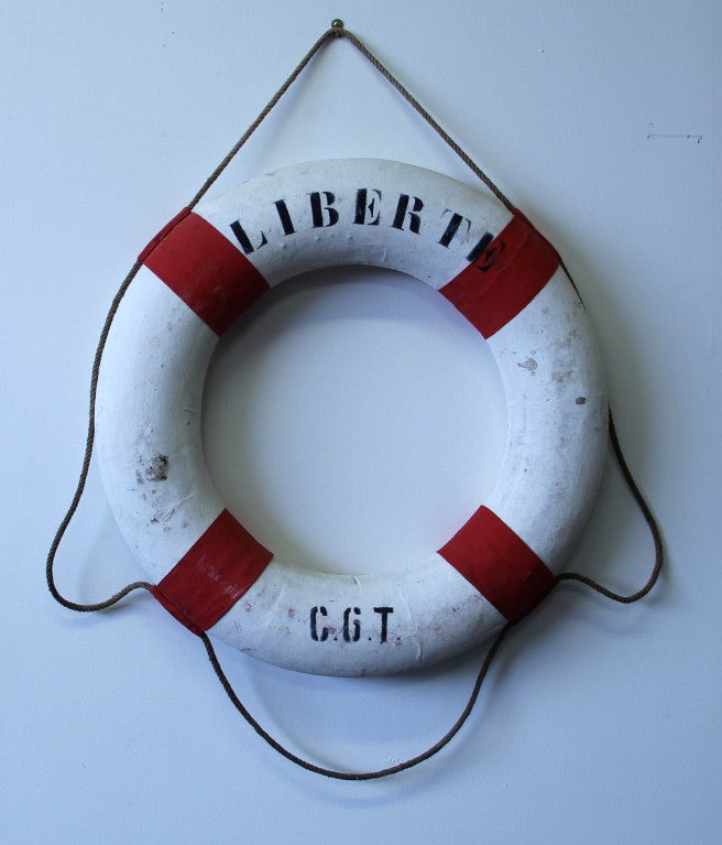 Vintage lifebuoy from Compagnie Général Transatlantique's luxury cruise ship the Liberté. Sailed 1946-1961 Stamped makers mark in black ink.