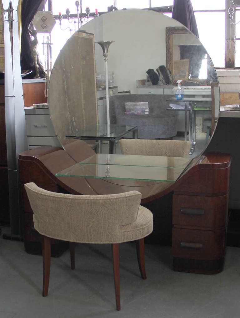 A striking French Art Deco mirrored vanity and stool.
