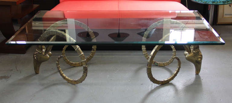 Stunning brass Ibex or Gazelle glass top coffee table.  Glass top is 3/4