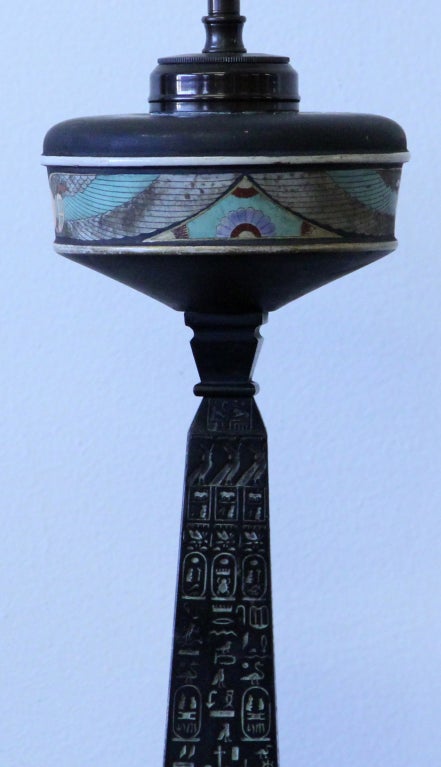A rare Egyptian Revival table lamp. This replica commemorates the bringing of the Egyptian obelisk inaccurately but commonly called Cleopatra's Needle from Alexandria to London, where it was placed on the Thames Embankment in 1878.
Markings: