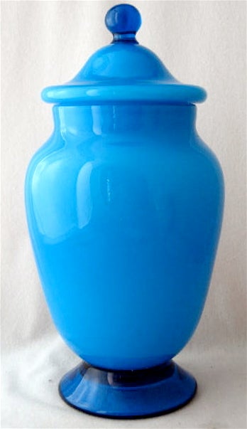 Barovier et Toso turquoise cased lattimo ginger jar, circa 1950.  Sister pieces in the same line are shown in ITALIAN GLASS CENTURY 20 by Leslie Pina at page 36, note the identical colors and stem. Please see the matching candy dish.