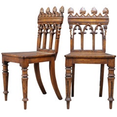 A pair of Victorian oak hall chairs 