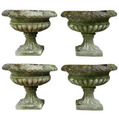 Four composition stone tazza urns