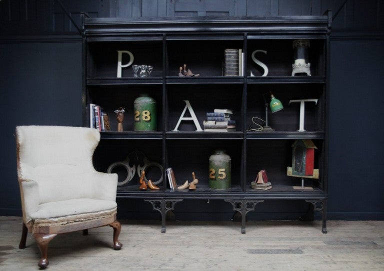 A pair of Ebonized Library open Bookcases in the Manner of A. W. N. Pugin and E W Pugin, manufactured Circa 1883.

Cast iron legs with a blue slate base to which the ebonised pine body is fitted, adjustable shelves with dustcovers.

Provenance: