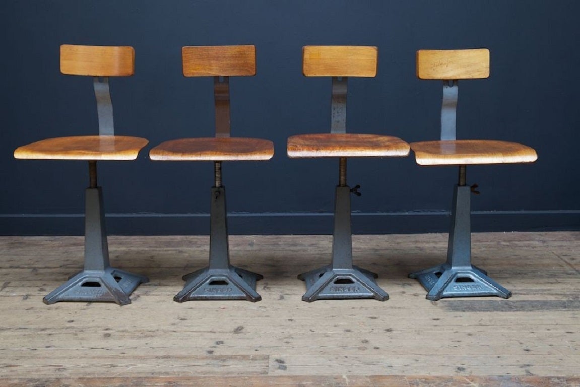 Singer machinist or work chairs. 

Branded cast iron base with factory painted finish, steam bent ply seat and back rest. 

Manufactured by ” Simanco” the Singer Manufacturing company. 

Designer unknown. 

English 1930s. 

Price is per