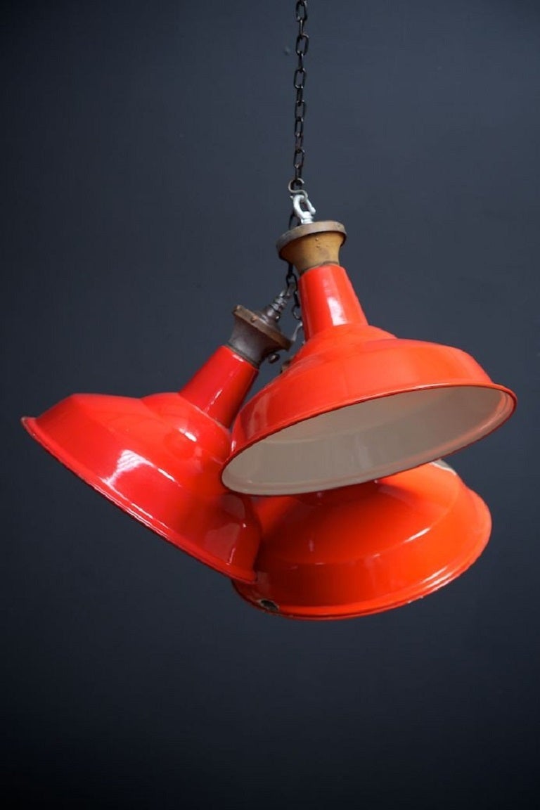 Factory enamelled red industrial pendant lights, by Benjamin, ex power station. 

Rare colour combination. 

English 1950s. 

Price is per pendant, six (6) available. 

Supplied Rewired and PAT tested, suspension chain and ceiling hook