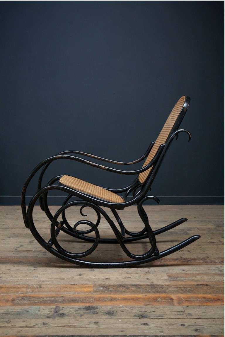 Thonet Model No. 10 rocking chair, circa 1880.
An outstanding example of a design classic, the ebonized light but strong wood curved by hot steam and stamped 'THONET' to base.

This example has the original cane seat and backrest and also appears