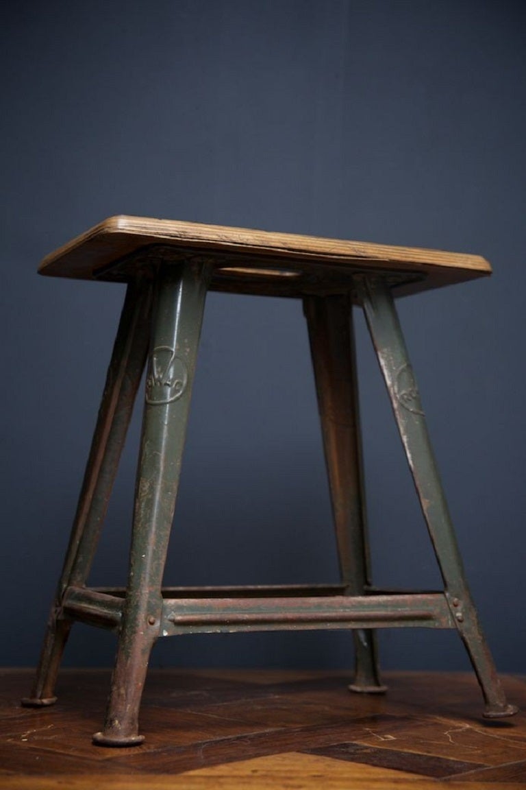 Exceptionally original example of a Rowac work stool. 

This was the stool of choice for workers in the Bauhaus in the 1920s-30s. 

Folded and pressed steel with original beech seat with hand hole. 

Produced by Robert Wagner Chemnitz.