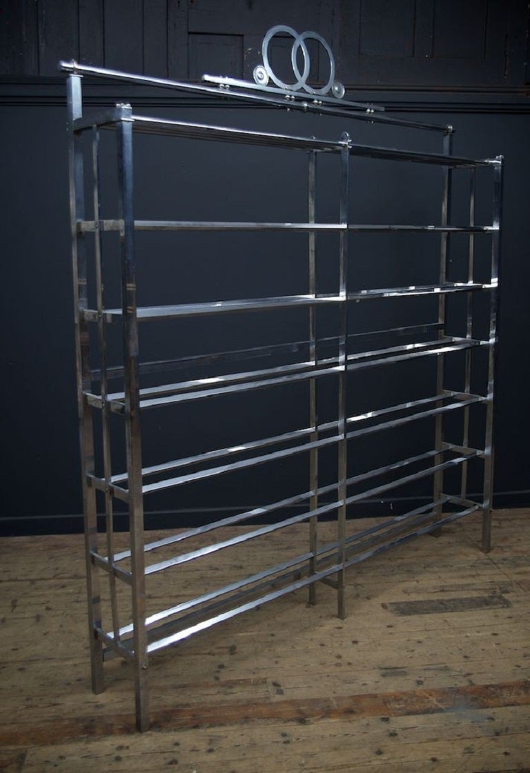 A chromed bronze etagere, retail display, exceptional quality. 

Seven glass shelves, freestanding or wall mounted. 

Parisian 1960s. 

:230 W:197 D:30 CM