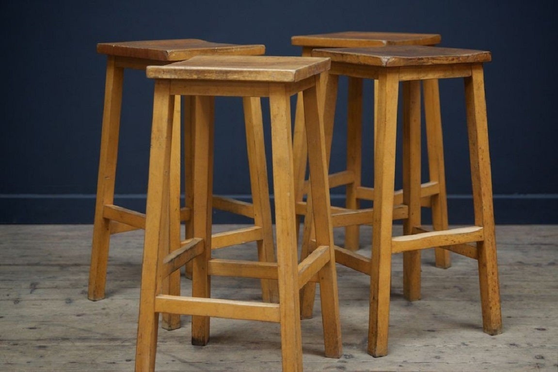 Lab stools with square but shaped seats . 

Maple and beech construction. 

1970s. 

Twenty nine (29) available, price is per stool. 

H:60 W:30 D: 30 CM