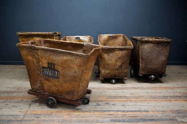 A rare collection of early hide, possibly buffalo, mill carts on timber frames with cast iron wheels.
The hide is overlapped and suported by thin metal uprights, hen stitched together with a leather thong.
We found these in the original carpet