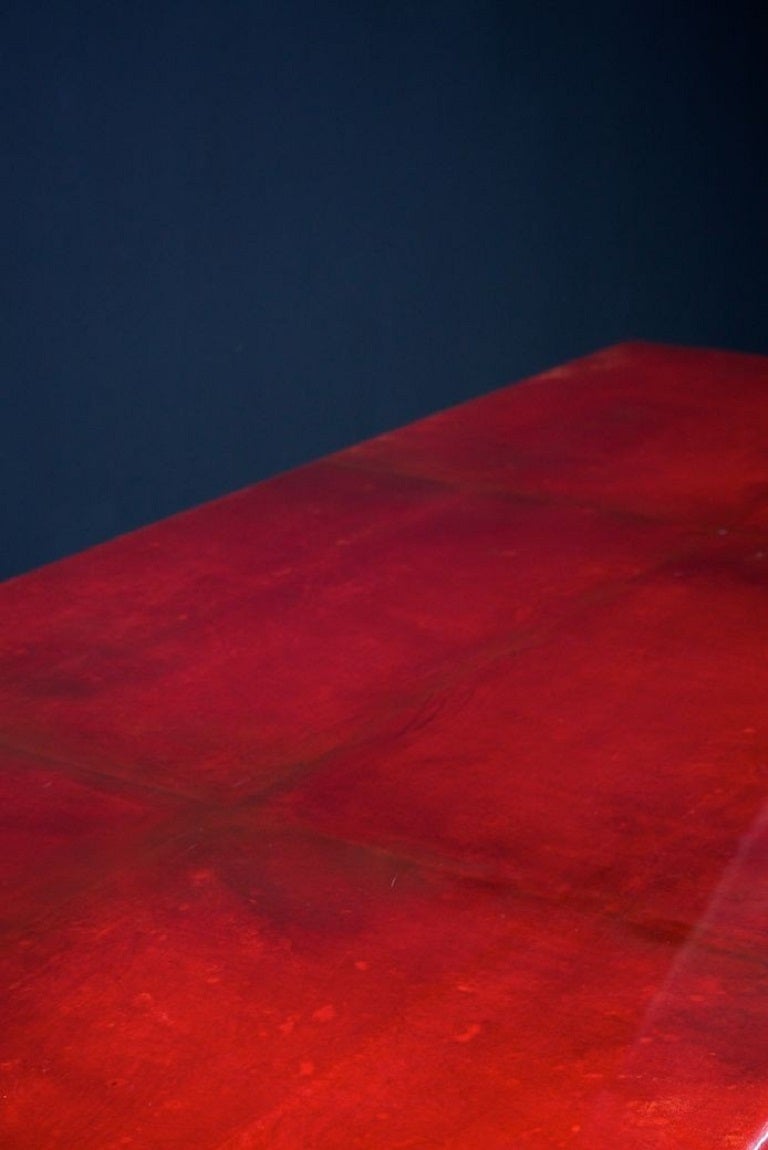 A spectacular red goatskin dining table in the style of Karl Springer. 

Twin pedestal supports, brass detail to table edge and pedestals, incredible colour.

A modern American classic. 

USA 1980s. 

H:73 W:250 D:99 CM. 

Some marks and