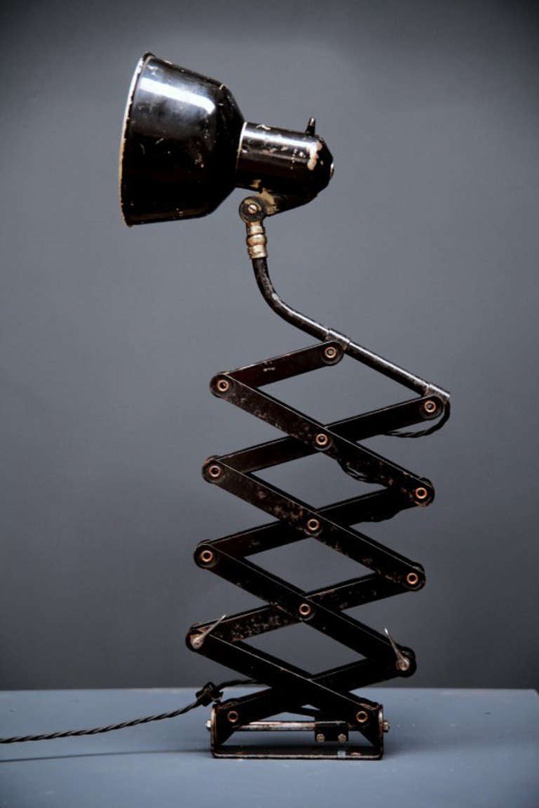 A wall mounted industrial scissor light with extending arm. 

The adjustable shade wth original rotary switch on scissor extending arm and swivel wall mount. 

Makers mark to mount reads 'Oben'. 

European, c.1950s. 

