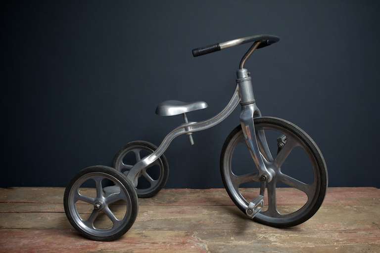 American childs tricycle with cast alloy frame and seat with rubber tyres.
Marked made and designed by Anthony Brothers.
20th Century.
In 1949 Tony Anthony began selling his invention, the Convert-O Bike, under Anthony Brother's Refrigeration Co.