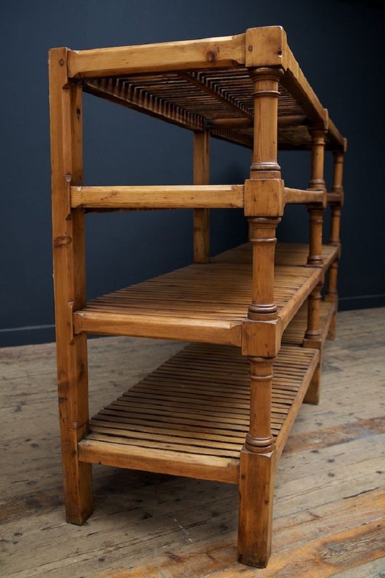 A large Golden oak Solicitors deed rack. 

Turned front supports with four shelves behind with square section rear uprights. 

Unrestored original. 

Scottish circa 1860. 

H: 107 W:226 D: 53 CM.