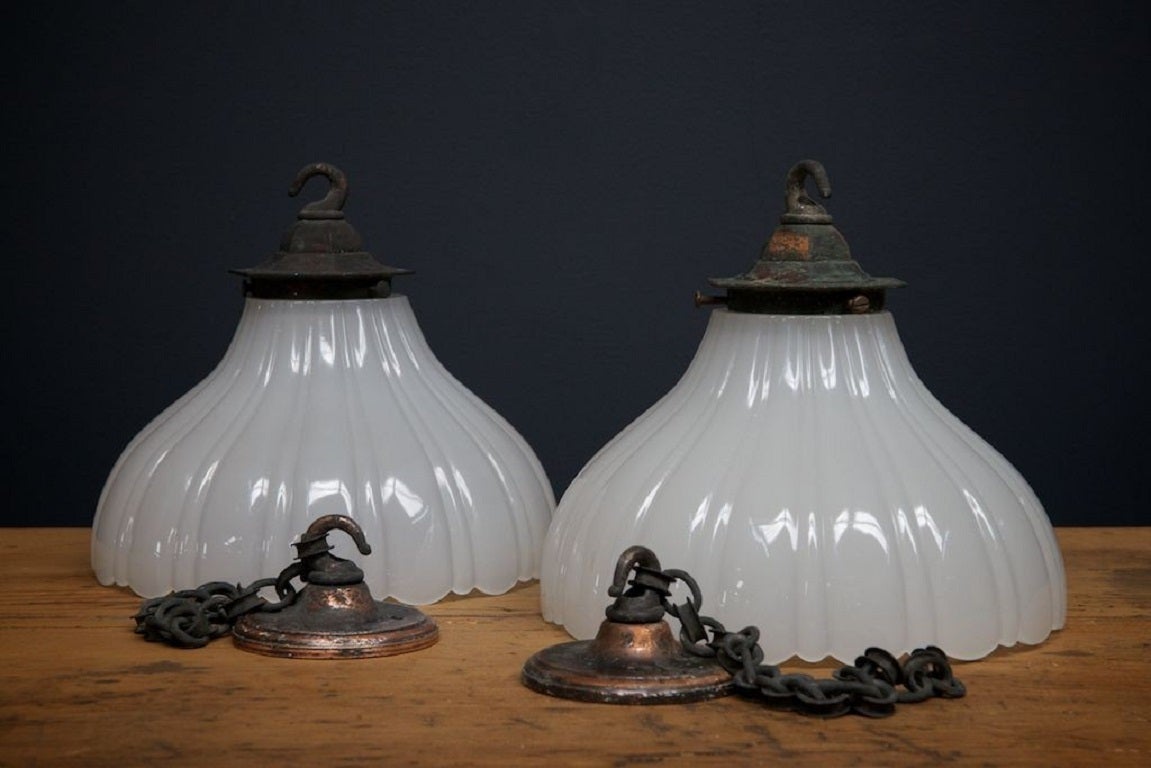 Superb quality fluted opalescent glass pendant lights, bronze hexagon galleries with a short length of the original chain and ceiling hook is also original. 

Manufactured by Jeffersons of Canada. 

1910. 

Rewired and PAT tested. 

Price is