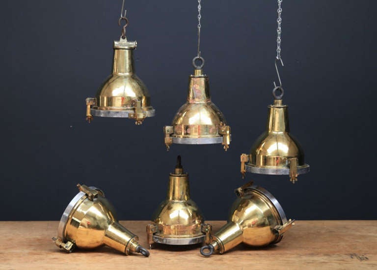 Brass and aluminum cargo lights. 

Original maritime lighting salvaged from stripped ships. 

1950s. 