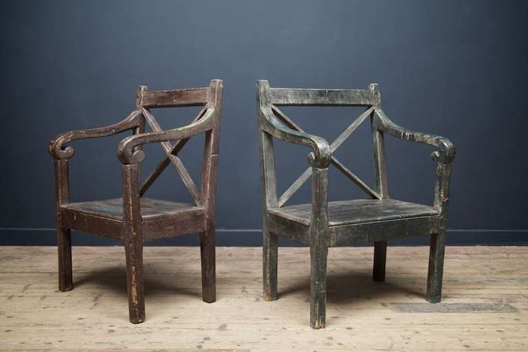 A near pair of sculptural painted Country open armchair.
Original painted finish to both, as a pair found on a croft on the IOM and then stored as found for the last 20 yrs.
This form of chair with basic x frame back splat is unique to the Isle of