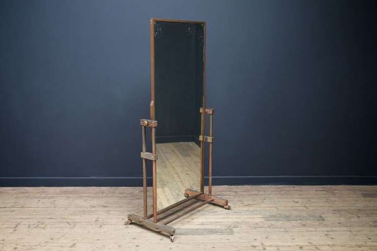 A free standing double sided shop mirror.
Steel brass and nickel plated base, original mirror plates to both sides in brass frame.
Fabulous wear, heavy weight construction.
1930s.
Height: 157 cm Width: 76 cm Depth: 46 cm